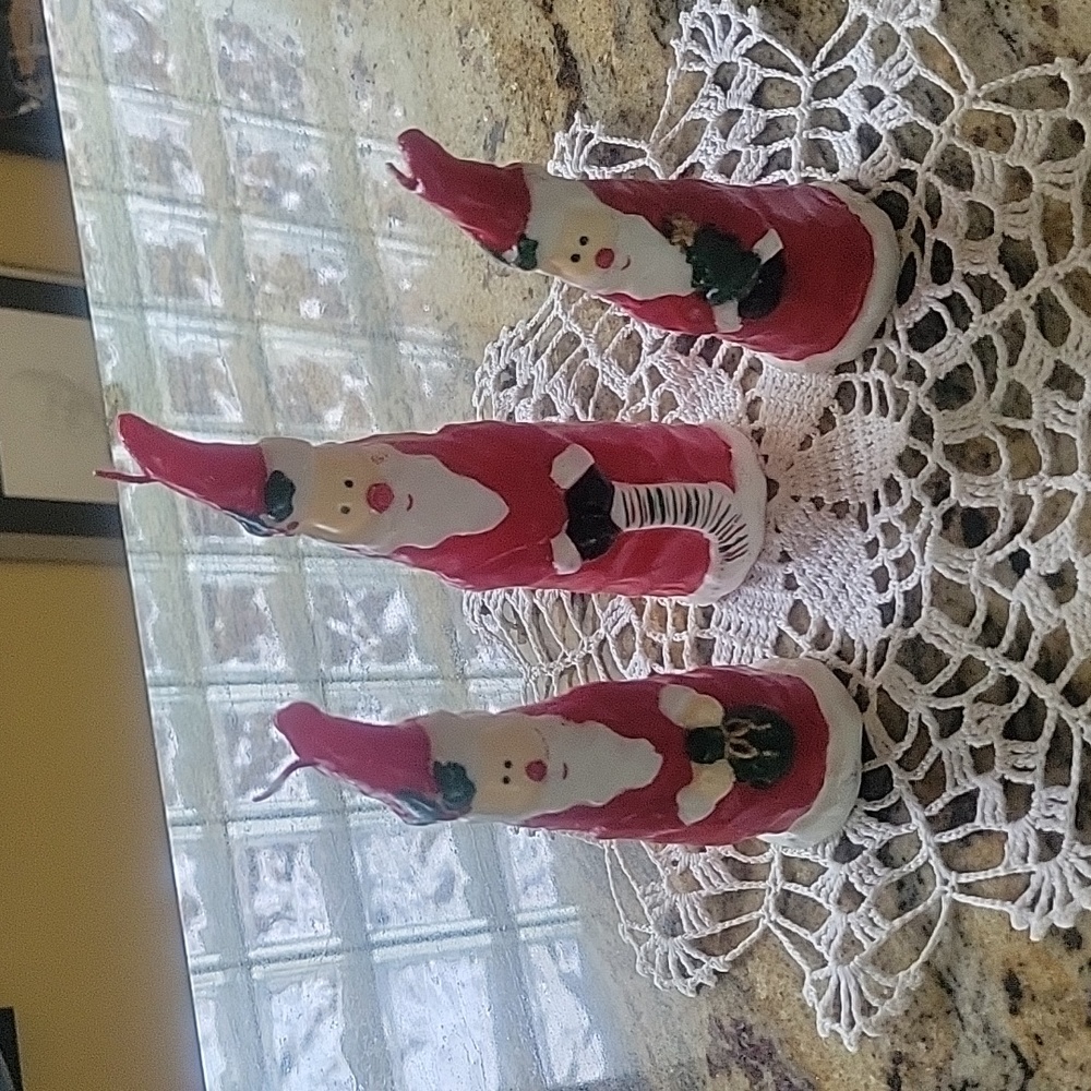Three super cute Santas candles